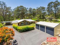  36 Flametree Ct Cedar Grove QLD 4285  $449,000 Family Space, Car Space, Yard Space ! Enjoying a private and quiet position here at the end of this cul de sac on 5,237 sqm (acre and quarter) with town water, your inspection will reveal a well presented family home, with separate office, plenty of secure car storage, a large outdoor entertainment area and an abundance of yard space, all of which is accessed from a sealed driveway. The separate office is positioned adjacent to the house, ideal for a home business, without intruding on your family space. Good news too, as a separate rumpus area if the kids want more space and you want peace and quiet ! The open plan living offers plenty of comfortable lounge space, where you can relax in reverse cycle air-conditioned comfort and the dining area too as you can see from our images will accommodate the largest dining room tables. High quality solid timber floating floors are a welcome and low maintenance addition to the living spaces. Plentiful bench and cupboard space as well, in the well-proportioned kitchen with views out through the entertainment area to the yard beyond.  The master bedroom, set away from the rest, has a good sized walk-in robe and en-suite, while the other bedrooms each have a built-in robe. Outside, the spacious entertainment area easily accommodates both the outdoor setting as well as a Pool Table, which in this case I am told, will be included in the sale. Car space is impressive with the extensively powered 3 Bay Shed, that includes a 15A outlet and higher than normal doors. It’s complimented by the double carport at the side of the house and there is even an additional covered storage area out there in the back yard as well as some other smaller storage sheds. For the young family looking for space to let the kids run free, or perhaps those of us ready to downsize and cut down on maintenance, this well presented family home offers potential solutions to a broad range of family wants and needs. Come and see what it can do for you ! Property Details Elders Property ID: 8937866 3 bedrooms 2 bathrooms 5 car parks Land Area 5237 square metres 5 car garage 