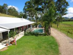  1465 Maleny-Kenilworth Rd Conondale QLD 4552 $495,000 PRICE SLASHED - THIS IS THE BEST BUY ON THE BOOKS! This stunning 23 acre property features a modern 3 bedroom home, self contained one bedroom flat, and endless acres of level, usable paddocks!  Located in Conondale, just 15 minutes from Maleny, the home sits perched on an elevated site overlooking the glorious views from the surrounding countryside to the Conondale Ranges and beyond.  *23 acres of useable land *Perfect North-East aspect *House in elevated fully fenced position *Self contained 1 bedroom, 1 bathroom flat - Income potential *In-ground pool and outdoor entertaining area *Fully fenced paddocks with spring fed dam *20,000 Gallon water tanks With so much on offer, this property presents a fantastic opportunity! 