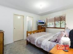  36 Flametree Ct Cedar Grove QLD 4285  $449,000 Family Space, Car Space, Yard Space ! Enjoying a private and quiet position here at the end of this cul de sac on 5,237 sqm (acre and quarter) with town water, your inspection will reveal a well presented family home, with separate office, plenty of secure car storage, a large outdoor entertainment area and an abundance of yard space, all of which is accessed from a sealed driveway. The separate office is positioned adjacent to the house, ideal for a home business, without intruding on your family space. Good news too, as a separate rumpus area if the kids want more space and you want peace and quiet ! The open plan living offers plenty of comfortable lounge space, where you can relax in reverse cycle air-conditioned comfort and the dining area too as you can see from our images will accommodate the largest dining room tables. High quality solid timber floating floors are a welcome and low maintenance addition to the living spaces. Plentiful bench and cupboard space as well, in the well-proportioned kitchen with views out through the entertainment area to the yard beyond.  The master bedroom, set away from the rest, has a good sized walk-in robe and en-suite, while the other bedrooms each have a built-in robe. Outside, the spacious entertainment area easily accommodates both the outdoor setting as well as a Pool Table, which in this case I am told, will be included in the sale. Car space is impressive with the extensively powered 3 Bay Shed, that includes a 15A outlet and higher than normal doors. It’s complimented by the double carport at the side of the house and there is even an additional covered storage area out there in the back yard as well as some other smaller storage sheds. For the young family looking for space to let the kids run free, or perhaps those of us ready to downsize and cut down on maintenance, this well presented family home offers potential solutions to a broad range of family wants and needs. Come and see what it can do for you ! Property Details Elders Property ID: 8937866 3 bedrooms 2 bathrooms 5 car parks Land Area 5237 square metres 5 car garage 