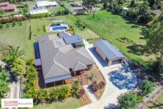 733 Old Gympie Rd Burpengary QLD 4505 $779,000 LOOKING FOR THE 'WOW' FACTOR? THAN LOOK NO FURTHER!! If you would like a video tour sent to your phone, text TOUR138 to 0418 322 878 (standard text charge applies) Welcome Inside: Step into the entrance foyer of this home and feel the light & space create a warmth of welcome. This generously proportioned family home is set on a 3000m2 block with all the perks of country living, without losing the convenience of living so close to town. Built in 2009, the home features a great sized kitchen which is positioned perfectly to service both indoor & outdoor dining with a view to the outdoor deck & mountain ranges in the distance. * Large kitchen with stainless steel appliances, down lights & breakfast bar * Huge open plan dining/living/kitchen * Plus a formal dining/music room * Massive rumpus room opening out onto the front deck * Master bedroom with bulk head lighting, ensuite and robe. * + 3 Queen bedrooms with carpet, fans & built in robes * Spacious 5th bedroom for the growing family * Study / 6th bedroom * Internal laundry with plenty of bench & cupboard space * Reverse cycle A/C & security screens * Floating timber floors * Storage options * 325m2 under roof living * Great dual living opportunity Take a Look Outside: Stroll out onto the rear undercover entertainment area, where the BBQ & outdoor kitchen make summer afternoon entertaining a breeze. Climb into the spa with a glass of bubbly to relax while you watch the kids play in the pool down the back. * Covered entertainment deck with outdoor kitchen * 6 person heated spa * I/G saltwater pool + 2nd covered entertainment area * 6m x 12m powered shed & workshop * Concrete driveway * Low maintenance landscaped gardens * Fully fenced 3000mt yard * Children's swing set & fort play area * 6000L Water Tank plumbed to toilets & laundry * Solar hot water $$$$ savings * Citrus trees * 2 min to Westfield North Lakes * School bus pickup at the door * 2 min to train station * 1 min to Bruce Hwy This home offers points of difference that makes it stand out amongst the crowd. Don't wait too long as properties with this kind of appeal do not come along too often. Call Mal Lucas today to secure your dream property! Other features: Built-In Wardrobes,Close to Schools,Close to Shops,Close to Transport,Garden Property Details Elders Property ID: 8600701   5 bedrooms 2 bathrooms 4 car parks Land Area 3000 square metres 4 car garage Swimming Pool Air Conditioning 