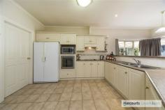  19 David Randall St Williamstown SA 5351 $380,000 - $400,000 Garden lovers will appreciate the many varieties of flowers, shrubs, trees & veggies on this picturesque, landscaped block that is 1263sqm in size. If peace & quiet is what you want this is your ideal home, a haven from the busy outside world. Features include: - 	 4 bedrooms, all with BIRs - 	 Master bedroom with en-suite, walk-in-robe & ceiling fan - 	 Kitchen with ample cupboards & walk-in-pantry - 	 Large open plan meals & family room - 	 Formal Lounge  - 	 Main 3-way neutral bathroom with dual sinks - 	 Wood combustion heating - 	 New ducted evaporative cooling  - 	 High ceilings, Stamford doors & quality through-out - 	 Large entertaining area - 	 Double garage under the main roof with electric roller doors, rear access & internal access - 	 3KW solar power - 	 Roller shutters  - 	 Garage with concrete, power & 2 roller doors  - 	 Garden shed - 	 Bird aviaries  - 	 2 x rain water tanks, house connected to rain water - 	 Ample fruit trees including weeping mulberry, apple, pear, apricot, plum and established veggie gardens - 	 Established gardens with under-ground dripper systems and spray systems - 	 Plus so much more For an extensive tour of this property, feel free to call us today to arrange a time David Washington 0403 167 459 Cassandra Washington 0403 167 458 Land Size 	 1263 sqm Approx year built 	 1997 Property condition 	 Excellent Property Type 	 House Garaging / carparking 	 Internal access, Double lock-up, Auto doors, Free standing Construction 	 Brick veneer Heating / Cooling 	 Woodfire (Closed), Solar, Ducted Property Features 	 Safety switch, Smoke alarms Chattels remaining 	 Blinds, Drapes, Fixed floor coverings, Light fittings, Stove, TV aerial Kitchen 	 Modern, Open plan, Dishwasher, Breakfast bar and Pantry Living area 	 Formal lounge, Separate living Main bedroom 	 Double, Walk-in-robe and Heating / air conditioning Ensuite 	 Separate shower Bedroom 2 	 Double, Built-in / wardrobe and Heating / air conditioning Bedroom 3 	 Double, Built-in / wardrobe and Heating / air conditioning Bedroom 4 	 Double, Built-in / wardrobe and Heating / air conditioning Additional rooms 	 Family Main bathroom 	 Bath, Separate shower Laundry 	 Separate Workshop 	 Combined Outdoor living 	 Entertainment area (Covered), Garden Fencing 	 Fully fenced Grounds 	 Tidy, Backyard access Garden 	 Garden shed (Number of sheds: 2) Water supply 	 Mains, Tank Locality 	 Close to transport, Close to shops, Close to schools 