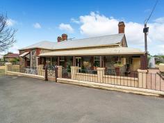  8 High St Strathalbyn SA 5255 $319,950 OPEN SATURDAY 23/4/2016 - 11AM - 11:30AM Property ID: 8668062 “Stone Gate Cottage c1860 Standing the test of time and proudly sited on historic High Street is this charming bluestone return verandah villa. The character home is positioned on a manageable 468m2 allotment within a stone’s throw to township facilities. The traditional floor plan features a spacious family lounge, formal lounge, kitchen with dishwasher, dining room, 3 bedrooms, renovated bathroom, laundry and a delightful cellar. The villa has many quality features including polished timber floor boards, operational open fireplaces with appealing surrounds, glass panelled interior doors, combustion heating and reverse cycle split system air conditioning. Attached to the rear of the home is a quaint paved outdoor living area with caf blinds ideal for year round entertaining. Further external improvements include a double carport, 6.2 × 6.3m colorbond lock up garage complete with cement floor and power and rainwater storage plumbed to the home. The location of this property, being adjacent to the northern end of the popular antique centre is well placed for many uses including Bed & Breakfast and professional services, notwithstanding the fact that the property is located within the township zone code of Residential (Strathalbyn) Precinct 23 Strathalbyn Historic Central, and any change would necessitate Council approval. Property History- John Stephens, a butcher acquired an L shaped part of Lot 38 in 1860. In 1861 it passed to William Stephens, a blacksmith. From 1866 Stephens leased the property to other blacksmiths. The section behind William Read’s allotment was sold off to Colin Thomas in 1884. The remaining part of the property was transferred to Isaac Wheadon, a blacksmith, a few weeks later. Wheadon has leased this property and part of Lot 39 from William Stephens before purchasing it. Wheadon mortgaged the property to William Stephens and Stephens gained possession later in 1884. Robert Thomas acquired the property in 1908 and it was subdivided in 1920. Henry Marshall Hall Robinson bought this part of the land in 1921. He sold it in 1923 to George Thredgold, a mason, who owned until his death in 1938. Land Area 	 468.0 sqm 