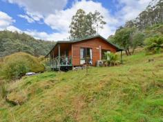  88 Palmers Rd Oyster Cove TAS 7150 $260,000 Country Roads Take Me Home Located 35 minutes from Hobart on approximately 3.5 acres of land, this home has everything you need to escape the hustle and bustle of the city. Consisting of three bedrooms, this home is situated close to the bushland and above a creek. The kitchen and lounge are open planned and features a wood heater and heat pump to make you feel cosy in the winter and cool in the summer. Through to the lounge you'll gain access to the front deck which is a great spot to sit and take in the quiet. Down the hall you'll find three bedrooms and a bathroom with separate toilet. With the timber cathedral ceilings and timber walls this home has the feeling of a log cabin. With a little bit of work this home has the potential to be your dream home with the luxury of nature all around you.  Only 5 minutes away from a fruit and veg store and 15 minutes from the Snug falls track makes for a relaxed lifestyle.   Property Snapshot  Property Type: House Construction: Weatherboard House Size: 92.00 m2 Land Area: 3.54 acres 