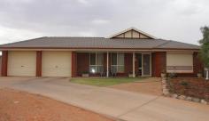  18 Melaleuca Ct Roxby Downs SA 5725 $540,000 INVEST IN BRICKS & MORTAR Property ID: 4772606 A quality built brick veneer home of 4 bedrooms, master with walk-in robe & ensuite, built-in robes in the other bedrooms. With a tiles entrance, cosy formal lounge room & formal dining room leading through to the open plan kitchen & family room. Ducted reverse cycle AC throughout. A double carport under main roof can be found behind roller doors & leading into the secure fenced rear yard with garage/workshop, verandah, paved entertaining area & lawn. All this & much more is located in an elevated position at the end of a quiet cul-de-sac. RLA 208715 Building / Floor Area 	 189 sqm Land Area 	 672.0 sqm 