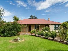  33 Sandergrove Rd Strathalbyn SA 5255 $449,950 Rose Dale - A Hidden Marvel c1900 Property ID: 9389407 Now how many times have you driven by no.33 Sandergrove and thought what’s behind that hedge? Well here’s your chance to discover one of the townships hidden gems.  Positioned on a versatile 1506m2 (approx) corner allotment with convenient dual access from both Sandergrove Road and quiet Fennell Street is this grand stone home full of character and old world charm. The much loved home has a unique floor plan for its era comprising 4 bedrooms, lounge with combustion heating, formal dining area, eat-in kitchen, updated family bathroom, utility room, laundry, separate toilet and original outhouse. Some magnificent character features include lovely high ceilings, polished baltic timber flooring, unique French doors, high skirting boards and open fire places. In the warmer months the classic home stays beautiful and cool with its wide front and side verandahs. No. 33 Sandergrove has been lovingly maintained over the years and professionally rewired for added piece of mind. Attached to the rear of the home is a north facing verandah area which is a brilliant spot for year round entertaining. Further external improvements include rainwater storage, double garage with concrete floor and rustic single garage with power and direct access from Fennell Street. The balance of the property is covered with lovely established gardens and of course the iconic hedge on Fennell Street. Walk to near-by, sporting, schooling and township facilities. Be a part of Strathalbyn’s History! Building / Floor Area 	 211 sqm Land Area 	 1,506.0 sqm 