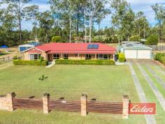  28 Squatter Ct Jimboomba QLD 4280 How Good Is (all of) This ! The house, The shed, The pool, The acre and The outdoor entertainment area – all here and all good news ! Situated at the end of this quiet cul de sac on a level acre (4000 sqm), with town water, your inspection here at Flagstone will reveal a well presented steel framed family home with all the MUST HAVE features already in place. You will enjoy a comfortable air-conditioned lounge with views out over the front of the property, leading through to a separate dining on one side of the kitchen with the family room being open plan to the kitchen on the other. Like the lounge, air-conditioned comfort awaits your inspection of the family room, complimented perfectly by a combustion heater for those chilly winter evenings. Plenty of high and low level cupboards in the kitchen with plenty of bench space too and views out through the entertainment area to the pool and all that yard and shed space beyond. Double built-in robes feature in all the bedrooms, while the air-conditioned master has a walk through robe, his on one side, hers on the other, to the en-suite bathroom which also benefits from an oversize shower a thoughtful addition and something that you will also find in the family bathroom. The outdoor entertainment area is perfectly positioned for easy access to the in-ground salt pool, the perfect spot for your family to cool off on those hot summer days. The shed space is sure to impress – 6m x 12m, with an internal (removable wall) to give dedicated workshop space at the back, plus an additional 6m x 7m high car port to give an additional sheltered work area, as you can see in our images. So it’s currently configured for 2 car storage and large workshop. Alternatively it can be used for 6 car storage – the choice is yours. You will also find 2 more garden sheds and a large chook shed in the back corner, so fresh eggs are included in the sale ! Schools, shops, parks and more are within walking distance, with more on the way, while Brisbane is yours within the hour and the Gold Coast a little over.  So if you have been looking for that (almost) mythical family home that has it all – the pool, the shed, the 4 bedroom steel framed home, the outdoor entertainment area all of which is on a level acre in a quiet street, then your search is over. Book your inspection and bring your deposit, because if you don’t then somebody else will ! Property Details Elders Property ID: 9679599 4 bedrooms 2 bathrooms 6 car parks Land Area 4000 square metres 6 car garage Related Elders Services Elders Home Loans Loan Calculator | 1300 LENDING Elders Insurance Request a Quote | 13 LOCAL 