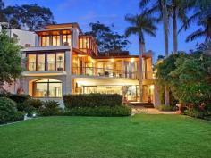  1802 Pittwater Rd Bayview NSW 2104 $7,500,000 A flawless absolute waterfront set on 1,130sqm 'Semloh' boasts a coveted northerly aspect and timeless architectural design by the renowned Walter Barda. This exquisite masterpiece represents the very best that the area has to offer, with direct Pittwater views captured from virtually every room and only 45 minutes to Sydney CBD. One of the few Bayview properties providing significant water depth at all tides, its impressive range of facilities can accommodate a large boat of up to 50 feet. There's a 107sqm jetty plus a slipway, fully equipped boatshed and a private sandy beach. Vast interiors are warm and inviting with abundant natural light. They include formal and informal living and dining areas, a billiard/a/v room, study and a self-contained lower level with a bar, wine cellar and a sauna. The property displays extensive use of bespoke timber throughout, while the floors are an attractive blend of Italian limestone and recycled blackbutt. Entertaining spaces comprise a gas heated salt water pool and spa, large deck, Tuscan inspired courtyard and a terrace. Four bedrooms have ensuites and the lengthy gourmet kitchen offers St George/Miele fixtures plus a walk through pantry. Other features include two gas fireplaces, alarm, air conditioning, ducted vacuuming, plantation shutters and a four car garage. Enjoying an immensely tranquil setting with direct access to boating clubs, this enviably private double brick home is simply extraordinary.   Property Snapshot  Property Type: House Land Area: 1,130 m2 Features: Air Conditioning 