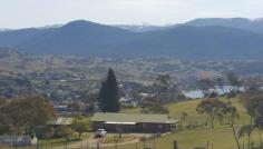  5661 Kosciuszko Rd East Jindabyne NSW 2627 $899,000 A rare find this close to Jindabyne Property ID: 8737323 Spectacular views abound from this 16 Acre property. Looking across the town of Jindabyne and up to the winter snow capped mountains plenty of space to yourself yet only a few minutes (5km) to town. The property itself has a recently renovated designer kitchen finished with solid timber and European beech. 2 separate living areas that take advantage of its position on the property to take in the panoramic scenery. In the main living area is a slow combustion fireplace and new curtains and paint throughout . Located opposite Tyrolean village at an altitude over 1000m their is plenty of potential for future development or just relax and take it all in from the established house which features 3 bedrooms with built in wardrobes, new carpet through out and 2 bathrooms with new fixtures. The covered veranda allows outdoor entertaining while secluded enough to enjoy privacy. 6 fenced paddocks would allow hobby style farming with a bore on the property and tanks that can hold over 70,000 litres of water to help look after the 20 established olive trees, 2 almond trees and some cherry and plum trees. The newest tank is a pioneer 60,000 litre tank installed recently. Other infrastructure on the property include a garden shed and a large working glass house.  