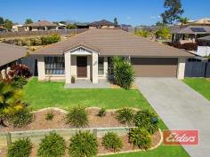  7 Wildwood Cres Jimboomba QLD 4280 $419,000 Perfectly Presented here in Prime Position Enjoying an elevated position here in the former display home location at Flagstone, this is your opportunity to secure an impressive and inviting home, here in a top spot surrounded by other similarly well presented properties. Shops, schools, childcare, parks and more are within a short walk, in what is the destination of choice for an ever increasing number of families, keen to enjoy a better and progressive lifestyle, in this strategically important and progressive location. Your inspection will reveal an exceptionally well presented family home with a lounge room from which you can enjoy an elevated and open outlook, while the family and dining area flows seamlessly to the al fresco dining area and round to the mature, terraced back yard beyond. The master bedroom, positioned at the rear of the property benefits from both a spacious walk-in robe, and suitably stylish en-suite, which is entirely in keeping with the similarly stylish and well appointed family bathroom, while all other bedrooms feature double mirror built-in robes. The galley style kitchen offers the convenience of an easily cleaned ceramic cooktop, complimented by a stainless steel style oven and plenty of cupboard space, including a large pantry unit and obligatory and in this case NEW, dishwasher. The outdoor area that I mentioned earlier is both spacious and private, with a Spa located in the far corner. You will also find two garden sheds out there, one at each side of the yard, which has been terraced to offer a large level lawn area for the kids, with a backdrop of mature gardens offering plenty of variety and interest. So if the idea of owning a well presented family home, enjoying a prime elevated position here on this spacious 800 sqm block in a superb location, then an early inspection would be highly recommended. Property Details Elders Property ID: 10374626 4 bedrooms 2 bathrooms 2 car parks Land Area 800 square metres Double garage 