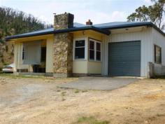  18 Torrens Valley Rd Chain of Ponds SA 5231 $360,000-$380,000 RENOVATE OR REBUILD - 2.5 ACRES Property ID: 9004716 Great location with no neighbours and only a couple of minutes to the local township. The property features a timber framed home with 2 bedrooms, separate living, and open plan kitchen/dining. Good shedding. Special features: River Torrens frontage and views. 2 bedrooms, however, currently used as single bedroom and extra living room. Renovated kitchen with electric range and also wood stove. Living with s.c. heater. Single enclosed carport, plus 30′ × 20′ workshop with power and light. Undulating gum studded 2.5 acres gives a dress circle view of the Bay to Birdwood run. Don’t miss the rare opportunity in securing a hard to find small easy-care parcel of land only minutes to Tea Tree Gully. Redevelop the home or start again. $380,000 Land Area 	 2.5 acres 