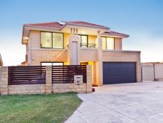  40 Clevedon Pl Kallaroo WA 6025 $799,000 - $829,000 IT'S ALL ABOUT THE LIFESTYLE! Open for Inspection:  Open By Appointment    At last, a much loved and sparkling, modern home could be yours, where the emphasis is definitely on relaxed family living. This 2010 built home is Ideally located in the beachside suburb of Kallaroo at the end of a cul de sac. Everything is so close: Whitford's Park, Whitford's shopping centre (currently undergoing expansion to include an open piazza with ten new restaurants), cinemas, gorgeous beaches, transport and schools including St Marks Anglican School...all within walking distance. So what do you get in this home that delivers such a mighty punch? - Four bedrooms including a guest room on the ground level with it's own private courtyard and ensuite - Three bedrooms on the upper level - Master bedroom with 'his and hers' walk in robes, ensuite with double vanities and large shower - Two minor bedrooms with walk in robes - Gleaming modern kitchen with island / breakfast bar, white cabinetry, drawers, 900mm oven, Miele dishwasher and double fridge recess - Inviting family room overlooking the rear garden and pool - Upstairs theatre / lounge with rear projector and screen  - Large alfresco balcony with ocean views - gorgeous sunsets and twinkling lights are yours to enjoy every evening with your friends and loved ones -Expansive alfresco area with fitted alfresco blinds overlooking the pool -Superb pool - a delightful focal point for summer enjoyment with solar heating and led colour changing pool lights - Funky bar area adjacent to the pool BONUS INCLUSIONS: - Wood floors - 12 Solar panels - Pool with solar heating and remote control colour changing LED lights - Alarm - Security screens - Large double garage with extra storage / workshop area - Fully reticulated private gardens - Liquid limestone driveway and pool surround - Fitted custom made alfresco blinds It is an absolute pleasure to offer this pristine home for the first time to the market. Perfect for families, young couples or retirees looking for an easy care home with the emphasis on enjoying the lifestyle. Be quick... CALL CAROL ARTHERN TO INSPECT ON 0413 910 945. I look forward to meeting you. 