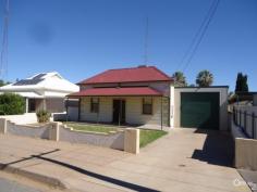  10 John Street Port Pirie SA 5540 $190,000  Family home with extras! Very well presented three bedroom timber frame home in Port Pirie South.  Laid out in classical style with the two front bedrooms running off the front passage and the third from the main lounge area. The rear country style kitchen is a generous size plenty of room for a meals area. The bathroom is stylish with separate bath and sower alcove in stylish neutral colours. The toilet and laundry are to the rear of the home.  The exterior of the home also has plenty of features set on the 813sqm (approx.) block including a double length carport with roller door, an extra- long garage that is powered and concreted plus the yard is separated from lawn area to rear fruit trees. Other features include the solar panels, air-conditioning and double rain water tank.  PROPERTY DETAILS $190,000  ID: 392209 Zoning: Residential 