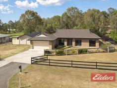  9 Turpentine Dr Cedar Vale QLD 4285 $479,000 Country Charm with this Family Home This is a lovely family home, the 9’ceilings give this home a spacious and airy feeling, and there is plenty of room for the family to spread out.  In true “Coral Home” style there is two living areas: the formal lounge with detailed cut out walls and the second one is the fully tiled open plan kitchen, dining and family room (comes with air-conditioner), this room is adjacent to the outdoor entertainment area which will make family functions a pleasure.  The main bedroom is large and comes with a walk-through robe and ensuite and its located away from the other 3 bedrooms – all 3 bedrooms come with built in robes and ceiling fans.  The home comes with a double integral garage and the added bonus is another big shed (11m x 6m) with power and a small shed on the side, there is also the cost saving 5Kva Solar power system. The backyard is very private and comes with a unique Rustic Theme Gazebo, chicken pen and plenty of room for a vege patch, this section of the backyard is fully fenced but there is more land beyond so if you are ever wanting a pony or a couple of sheep there is plenty of room for another paddock.  The Rustic Theme has been repeated at the front of the home with an outback fence and dry creek bed with deck, it’s been beautifully done and is a striking feature of this lovely home.  Set on a 1 acre block and located in the great Cedar Vale lifestyle estate, this home is just waiting for you, there is school bus pick up in the area too. Property Details Elders Property ID: 10680104 4 bedrooms 2 bathrooms 4 car parks Land Area 4141 square metres 4 car garage 