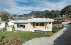  1/11 Farnell Place Glenorchy TAS 7010 $275,000 Spick & span, sunny & spacious This fantastic four bedroom home in a quiet cul-de-sac, yet only minutes from Northgate and the Glenorchy CBD, is sure to impress the astute buyer looking for a house that represents excellent value. There are four bedrooms, two of which are doubles, polished hardwood floors in the livings areas, semi open plan kitchen, dining, and lounge room, all presented in a neat and tidy well-presented package.  With a number of units behind the house providing extra security, there is no active body corporate to worry about. A secure backyard lawn area perfect for a dog, the children to play safely, or a barbeque with friends, this humble home ticks all the boxes for a first home buyer, expanding family, or investment at $350 per week.  With so much room for activities; the rumpus has a multitude of different uses, pool room, man cave, or second living area. The utilities room could be converted into a second bathroom.  • 	 Quite, sunny, and spacious rooms • 	 4 bedrooms 2 of which are doubles • 	 Sunny and open plan kitchen & dining • 	 Rent appraisal of $350 per week • 	 No active body corporate • 	 Rumpus perfect for a pool room • 	 Separate laundry & utility room • 	 Flat, low maintenance garden & lawn • 	 Quiet cul-de-sac position • 	 Only minutes to Glenorchy CDB  • 	 North-facing verandah • 	 Polished hardwood floors General Features Property Type: House Bedrooms: 4 Bathrooms: 1 Land Size: 494 m2 