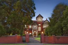  1 Harcourt St, Hawthorn East VIC 3123 Exemplifying exquisite craftsmanship and peerless detail that is rarely seen today, this historic c1900 Queen Anne Federation mansion 'Talana' offers a unique modern luxury across its sprawling floorplan of lovingly-preserved period splendour. Positioned on approx. 4,198m2 (45,187ft2), the triple-brick manor offers 5 bedroom plus study accommodation and abundant living and dining spaces, in addition to a self-contained one-bedroom summer house that lies between a sparkling azure pool and full-size synthetic tennis court in the midst of pristine lush and leafy landscaping, granting the sentiment of a grand country estate.  Designed by renowned 19th-century architect John Beswicke, the towering Tudor-style façade is enriched with its Marseille roofing and ornate cappings, a broad tessellated-tile encircling verandah, and Gothic-arched entry. Internally, an expansive foyer introduces the elaborate chandeliers, intricate leadlights, embellished fireplaces, and gleaming polished jarrah floorboards that flood the ground floor, beneath dizzyingly high ceilings boasting a rare and superlative ornate detail.  An array of immense living and dining spaces indulge entertaining or quiet family occasions equally, including a graciously proportioned sitting room with bay window reading area enjoying views over verandah and garden. An open plan family/meals zone seamlessly combines heritage grandeur and comfortable modern homeliness with a lavish fully-appointed granite kitchen enhanced with breakfast bar island bench, abundant storage and twin ovens. A separate formal dining room impresses with its marble fireplace adjacent to a sumptuous home theatre celebrating contemporary entertaining of built-in cinema screen and gas fire, served by a sizeable powder room with ornate timber vanity. The original servants' quarters have been reproduced as a huge laundry, including ironing and drying area.  A remarkable stained-glass window highlights the extravagant timber stairway leading to a copious living/retreat at the heart of the second storey where five generous robed bedrooms include a resplendent master suite offering a decorative fireplace beside a vast bay window, plus fitted walk-in robe and sumptuous ensuite amenity.  Completed by a luxurious family spa-bathroom, a copious games room fit for multi-purpose, and a home office offering a tranquil balcony and access to a unique tower sitting room with breathtaking panoramic views toward the city.  Securely positioned behind a high brick fence with remote iron gates from Harcourt Street and Auburn Road, the home is cossetted in the comforts of hydronic heating, security alarm, video intercom entry, solar and gas heating to the swimming pool, and a four-car remote garage with second storey storage.  Representing a truly rare opportunity, 'Talana' belongs to a tightly-held area within the Rathmines estate, providing walking distance to Melbourne's most prestigious schools, a short stroll to the quaint boutique shops and eateries at Auburn Village, and easy access to Glenferrie Road and Camberwell Junction shopping, with transport at the doorstep.  ID required at Inspection 