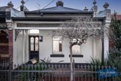  147 Wellington St, Flemington VIC 3031 Traditional character, complete comfort and a sunny courtyard backdrop lead the long list of attractions associated with this enticing Victorian terrace. The polished floors and high period ceiling of a classical entrance hall introduce two double bedrooms, each enhanced by original fire-places. A central living/dining area catches northern natural light and features its own polished floors, period fire-place and a Rinnai gas heater. Light filled renovated bathroom with laundry facilities. To the rear, a bright separate kitchen is beautifully presented and opens to a rear courtyard complemented by the natural advantage of north westerly aspects. Rear right-of-way provides the option to introduce off street parking if so desired. Mt Alexander Road trams, Flemington shops and the CBD all within conveniently easy reach. 