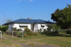  14 Link St, Bingara NSW 2404 $260,000 Enjoy the comfort of this inviting home, ideally located close to the main street in Bingara. There are lovely views of distant hills and farmland on the quiet end of Link Street. It's always been carefully maintained, and includes all the convenience, cosiness and qualities of country living. For Investment or Lifestyle, this is a beauty well worth inspection. Owner is retiring. FEATURES: 3 bedrooms (main with built-ins and ensuite) Spacious lounge room with tailored curtains, blinds and window awnings, rev. cycle a/c. Kitchen/Dining evap. a/c, simple u-shape design with overhead cupboards, elec. Stove/oven, rainwater to kitchen sink Formal Dining  Large hallway storage cupboards Sunroom with more built-in storage, new timber shutters Main bathroom shower, toilet, large vanity Laundry good size, includes elec. Hot water system Front and back patio with non-slip tiles/steps Double lock-up garage with workshop and covered fernery Established garden PLUS: 	 New roof Fully fenced Always well maintained 