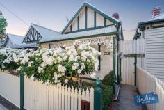  34 Gower St, Kensington VIC 3031 Ideally placed just a short walk to Macaulay Road shops and cafes, Kensington Train Station and JJ Holland Park, “Koojiro”, circa 1924, a freestanding, block fronted, three bedroom home will delight the full range of buyers with its renovated style, extended living and central locale. A traditional picket fence lined with iceberg roses precedes an intricate lacework veranda whilst a leadlight entry reveals a decorative hallway. The floor plan commences with two double bedrooms, one featuring an ornate open fireplace, the other split system air conditioning. The third which includes French doors to the hallway and also boasts an open fireplace is easily repurposed for formal living. The period inspired bathroom incorporates a bath, separate shower and timber vanity. A modern extension introduces a spacious open living domain with study nook. The smart kitchen presents soft-closing Hettich drawers, stainless steel appliances including Smeg cooktop and Simpson dishwasher as well as a servery window to a covered, elevated alfresco entertaining deck enjoying a sunny north-westerly aspect. Additional features include polished timber floorboards, high ceilings, attic storage, heating, air conditioning, a handy workshop and insulated floors, walls, ceiling and roof. Easy living with city fringe lifestyle advantages is sure to attract investors, young families, couples, starters and downsizers. Features - Adorned with period features including high ceilings, timber floorboards and open fireplaces - Three double bedrooms, one suitable to formal living, sharing a period inspired bathroom - Spacious open plan living with French doors to an elevated, alfresco entertaining deck - Fully appointed modern kitchen with stainless steel appliances and soft-close joinery - Split system air conditioning, workshop, attic storage, insulated floors, walls ceiling and roof - Walking distance to Macaulay Road cafes, Kensington Station and JJ Holland Park 