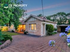  27 Albert St, Gumeracha SA 5233 $495,000 1465m2. Magnificent stone fronted 4 bedroom, 2 bathroom bungalow offering high quality living standards enhanced by many elegant features. Outdoor entertaining areas, double carport, large shedding and pretty gardens all on oversized allotment in popular township.   LAND: 1465m2 (over 1/3 acre). The property, with its size and establishment, provides plenty to admire and appreciate, whilst allowing that little bit more extra space to use and benefit from that is over and above that which standard size blocks offer. At the front, irrigated gardens along with a screen of plants supported by a sandstone block retaining wall, give privacy to the home, with the green front lawn giving a beautiful contrast against the colours of the stone fronted home. The paved driveway passes the home on its way to the double carport and, in turn, the large garage / work shed. The rear gardens are best viewed from the raised entertaining deck where neatly established, colourful, irrigated gardens are the foreground to the large shade trees located closer to the back boundary. Perhaps just a stroll through grounds, listening and observing the birdlife which is understandably drawn to the property, is the way to appreciate this setting. Located in the always popular pretty hills township of Gumeracha, its position is convenient to the town’s facilities, including the Primary School and the nearby park, along with being a scenic 20 minute drive to Tea Tree Plaza.   RESIDENCE: This 1930’s bungalow has been magnificently upgraded and is laden with a stylish elegance that has immense immediate appeal and will provide timeless admiration for its intending purchaser. Embraced by solid stone brick and underneath the renovated tiled roof is a home of generous proportions that offers high quality living standards. Stepping inside you are greeted by stunning timber floors that rest below high ceilings along with period architrave. These floors are also prominent in the living area where ornate ceiling roses and cornices are featured. A large slow combustion heater is recessed into the stone surround fireplace with mantle and gives a most welcoming winter warmth, whilst the ducted, reverse cycle heating and cooling system and split system unit give an abundance of instant year round comfort. The kitchen is spectacular with its offset tones of dark benchtops and high gloss, full height cabinetry. The stainless steel cooker with matching rangehood, the glass splashback, large fridge/freezer space, the wide breakfast bar, dishwasher and more are truly delightful. The home’s upgrade and extensions have seen the conversion of the original lounge to a new, very large, main bedroom with a gorgeous ensuite bathroom. The main bathroom has similar themes including floor to ceiling tiles, rainheads and both bathrooms are bright and superbly appointed. All four bedrooms have ceiling fans, with two of the large bedrooms having built-in robes. The second bedroom has its own external entry, making it ideal as an office or consulting room. The sunroom can be adapted to suit additional living, a commodious office, or a children’s playroom whilst enjoying the views over the rear garden.   IMPROVEMENTS: The first of the outdoor structures is the raised entertaining area which has brick paving, timber balustrades and two sets of steps, along with shade screens and also has direct access to the living area. A second outdoor entertaining area is by way of the rear verandah. The double carport provides ample undercover parking and the largest of the structures being the 10.9m x 6.0m garage with its concrete floor, lockable roller door and 3 phase power making it a very purposeful workshop. With a separate matching garden shed with lockable roller door and a nearby rainwater tank that assists the gardens along with the mains water connection, there is much to love about this beautiful property. 