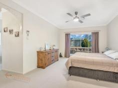  10-14 King Parrot Cl Boyland QLD 4275 $795,000 This home is offered for sale for the very first time.  This beautiful home gives the feel of a manor as you drive through the gates. Every room in the home is large and even the linen press and storage cupboards are walk-in and with 9 foot ceilings there is definitely a grand feel to the home.  This steel-frame, brick home with colourbond roof is set back from the road in one of the most prestigious areas in the valley. With a 5kw solar power system, solar HWS, a huge, in-ground rainwater tank, and 2nd smaller tank off the shed, this is a property that offers you the possibility of saving money and working with nature.  The home has a north facing aspect and is insulated with ducted air-conditioning and ceiling fans throughout, these features plus the wood burning stove make the home really cool during summer and warm during winter.  The tiled floors in the living areas, with feature insets, have a feel of luxury, with carpets in the lounge, bedrooms and media room for comfort.  The custom built manor kitchen with regal features and appliances plus beautiful timber bench tops overlooks the main living area and compliments the luxurious feel of the home.  The bathrooms are spacious and quality finished with high end fittings, floor to ceiling tiles, a large bath tub in the main bathroom and double basins and a double shower in the ensuite.  The grounds are cleared, except for a grove of old eucalypts offering a great spot to picnic in the shade in your very own yard and the owners have been planting fruit trees around the property too.  The garage, under the roof line, will house 2 cars, with remote control doors, and has a small storage nook to one side, offering an option to keep those things you want to have handy when going out in the car (prams, umbrellas, wheelchair, raincoats or picnic chairs, etc).  The seperate shed offers 3 bays and a workshop to one side, just behind the house. It has the solar panels on the roof, and whirlybirds and insulation to help keep it cool. This would be a perfect workshop or a place to store those extra toys.  The views from the front of the house capture Tamborine Mtn and overlook the expanse of your own front yard.  The home is beautifully finished and presented.  You must inspect this home today. It may well be the home of your dreams. Features Ducted Cooling Ducted Heating Open Fireplace Fully Fenced Outdoor Entertainment Area Secure Parking Shed Built-in Wardrobes Dishwasher Workshop Grey Water System Solar Hot Water Solar Panels Water Tank 