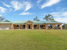  10-14 King Parrot Cl Boyland QLD 4275 $795,000 This home is offered for sale for the very first time.  This beautiful home gives the feel of a manor as you drive through the gates. Every room in the home is large and even the linen press and storage cupboards are walk-in and with 9 foot ceilings there is definitely a grand feel to the home.  This steel-frame, brick home with colourbond roof is set back from the road in one of the most prestigious areas in the valley. With a 5kw solar power system, solar HWS, a huge, in-ground rainwater tank, and 2nd smaller tank off the shed, this is a property that offers you the possibility of saving money and working with nature.  The home has a north facing aspect and is insulated with ducted air-conditioning and ceiling fans throughout, these features plus the wood burning stove make the home really cool during summer and warm during winter.  The tiled floors in the living areas, with feature insets, have a feel of luxury, with carpets in the lounge, bedrooms and media room for comfort.  The custom built manor kitchen with regal features and appliances plus beautiful timber bench tops overlooks the main living area and compliments the luxurious feel of the home.  The bathrooms are spacious and quality finished with high end fittings, floor to ceiling tiles, a large bath tub in the main bathroom and double basins and a double shower in the ensuite.  The grounds are cleared, except for a grove of old eucalypts offering a great spot to picnic in the shade in your very own yard and the owners have been planting fruit trees around the property too.  The garage, under the roof line, will house 2 cars, with remote control doors, and has a small storage nook to one side, offering an option to keep those things you want to have handy when going out in the car (prams, umbrellas, wheelchair, raincoats or picnic chairs, etc).  The seperate shed offers 3 bays and a workshop to one side, just behind the house. It has the solar panels on the roof, and whirlybirds and insulation to help keep it cool. This would be a perfect workshop or a place to store those extra toys.  The views from the front of the house capture Tamborine Mtn and overlook the expanse of your own front yard.  The home is beautifully finished and presented.  You must inspect this home today. It may well be the home of your dreams. Features Ducted Cooling Ducted Heating Open Fireplace Fully Fenced Outdoor Entertainment Area Secure Parking Shed Built-in Wardrobes Dishwasher Workshop Grey Water System Solar Hot Water Solar Panels Water Tank 