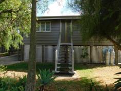  3 Madden Lane Rosewood QLD 4340 $265,000 Located in a quiet no through street in Rosewood, this sturdy timber home makes the perfect pad for the young family. There are three good sized bedrooms, a front sunroom that can be utilised as a study or sitting room or even opened back up to make a front verandah.  The eat in kitchen is large and features a stainless steel dishwasher (for the renovator at heart there is more than enough room to fit the largest of kitchens into this space).  Adjacent to the kitchen is the separate lounge that has A/C.  The bathroom has the shower over a small bath. Other features include timber floors throughout, French doors and high ceilings. The exterior of the home has been recently painted so no work needed there! The yard is level and with full fencing at the rear making it a safe place for the kids and pets.  Underneath the house is the laundry and fully concreted therefore offering loads of room for storage.  There is vehicle side access to the rear of the yard for those that may want to build a shed in the future.  For the cars, there is a tandem carport at the front as well as a single carport on the opposite side of the property. The Rosewood public state school is located at the end of the street and it is an easy walk to High School, town centre and railway station. 