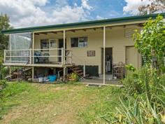  127-137 Larch Road Tamborine QLD 4270 $550,000 Tucked away in Tamborine you will find this property sitting on 9.9 acres of beautiful land. There are several options on offer with this property with others in the street recently selling in the high $700,000's. Current infrastructure includes a compact 3 bed house with 3 toilets, 2 showers, ceiling fans and fireplace.  2 x dams, solar hot water, bore (no power and will need a new pump),  1 x demountable storage with no power, huge 4 bay undercover parking for machinery, several shade houses / nursery's for the green thumb.  Fruit trees including some delicious dragon fruit. Why not live in the existing house while you build your dream home? Then renovate the old home as an additional dwelling?  OR demolish all existing infrastructure and create the property of your dreams?  OR simply renovate the existing home. Properties like these don't come up often - the Seller is motivated and prepared to meet the market this will sell quick! 