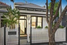  21 Bowen Street Prahran VIC 3181 The picturesque block fronted façade of this freestanding Victorian residence creates an irresistible first impression that is matched by impeccable interior spaces. Combining evocative period charm and sophisticated contemporary style, this welcoming home is situated on a charming heritage streetscape. Featuring timber floors and high decorative ceilings, the refined living room with open fireplace is complemented by open plan living and dining with study nook and adjoining gourmet kitchen boasting stone benches, Gaggenau oven, Miele gas cooktop and integrated dishwasher. Expanses of glass allow plenty of northern light to stream through, with a landscaped courtyard providing options for entertaining and dining. The generous main bedroom enjoys expansive robes, balcony and stylish ensuite, while two additional bedrooms with robes share a family bathroom. Includes wine and attic storage, garage with laundry and rear ROW. Moments from High and Chapel Streets, transport and schools.  