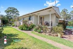  34 Maunsell St Moruya NSW 2537 $368,000 Synnova" - Situated near the end of a quiet street is this three bedroom, one bathroom home on a spacious 1168 m2 fully fenced block of land. The Home: Single level, dining area with wood stove, kitchen has a gas stove/electric oven and an island bench. A reverse cycle air conditioner is located in the lounge room. Bedrooms: All bedrooms have built in robes and the master has its own access to the back deck. Bathroom: Central bathroom with shower, bath and toilet. Outdoor Areas: A side patio, front patio and back porch for all of your alfresco entertaining. Garages/Sheds: Two car garage with workshop space set on concrete slab. There is a shade house and a shed at the rear of the block. Gardens: The hard work has been done with these colourful gardens including mandarin tree, rose bushes and vegetable patch. You’ll enjoy the privacy of the backyard that seems to extend forever. Location: A level walk to Moruya township and only a few minutes drive to beaches and you can launch your boat at either Moruya or Moruya Heads boat ramp. 