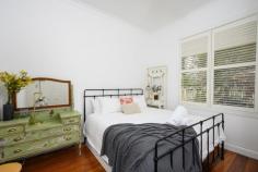  176 MANNING STREET KIAMA NSW 2533 $785,000 - $860,000 This wonderfully restored character cottage represents a slice of yesteryear, circ 1914, is centrally located and convenient to Kiama's stunning beaches, shops, cafes, station and schools. It enjoys many original features including wide timber floorboards, high ceilings and an ornate fireplace. Both kitchen and bathroom have been beautifully redesigned to allow the enjoyment of modern convenience whilst retaining its original elegance. With guest sleepout, lovely rear deck and landscaped gardens a viewing will more than delight. - Living room with a fireplace overlooking beautiful gardens  - Three bedrooms and a sleepout currently used as a B and B - Generous backyard, landscaped for privacy - Modern eat in kitchen, renovated bathroom with free standing bath - Large timber deck for entertaining - Central location convenient to the beach, schools and shops - Side driveway access to the backyard 