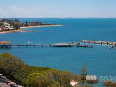  1205 / 99 Marine Parade, Redcliffe -  Waterfront Properties Redcliffe Your Penthouse Paradise at Mon Komo Your opportunity to "Live the Life" you have always dreamed of, on a permanent holiday in a Penthouse. If you are looking to make the ultimate seaside change, yet still live only a 35 minute drive to Brisbane, this penthouse apartment situated in the exclusive Residents Only Tower of Mon Komo is perfect for you! Your new north-east facing penthouse showcasing stunning views to Moreton Island, the Redcliffe Jetty and along Marine Parade is now available to purchase. Don't miss out. Features include:  • Spectacular north east facing uninterrupted views  • Enormous entertaining balcony, perfect for soaking up the view  • Entertainers kitchen with granite island bench  • Latest high-end European Siemens appliances including steam oven  • 2-pac kitchen cabinetry - soft close draws  • Enormous Master suite with dressing area, en-suite & private balcony  • Study nook with built-in storage & wine fridge  • 2.5 bathrooms, including ensuite + a powder room for your guests  • Spacious separate laundry with caesarstone bench & oak cabinetry  • Contemporary style with natural finishes  • Outdoor pool, heated indoor pool and gymnasium  • High ceilings  • Ducted reverse cycle air-conditioning and ceiling fans  • Modern new LED lighting throughout  • 3 side-by-side secure car spaces  • 9m2 lock up storage  • and so much more This luxury penthouse is just steps from the bustling Redcliffe café & restaurant precinct, Blue Water Square Shopping Centre and the beach. Call Kevin on 0418 125 256 to arrange your inspection. 