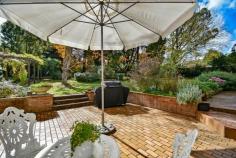  13 Old Wingello Rd Bundanoon NSW 2578 $680,000 - $720,000 A solid home offering something different. The painted brick and tile home has a Spanish flair with arched timber casement windows a feature of the property ensuring a garden vista from every room. Living areas all offer a perfect northern aspect with raked ceilings a feature of the grand living / dining space. Entry hall offers a good space easily converted to a home office if needed A new, modern centrally located kitchen with new appliances is the hub of the home with the perfect built in window seat for your morning coffee The sunroom is also currently used as a possible 4th bedroom / guest room and would make a perfect artist studio overlooking the splashes of colour in the rear yard All bedrooms have built in robes with the master accommodating a large walk in and direct access to the combined ensuite / laundry room There is a new S/C fire and numerous split systems for cooling and heating throughout Single garage with workshop space, garden shed and utilities shed at rear A private, terraced area off the living and kitchen offers another space to entertain and enjoy the stunning established gardens. A lovely mix of deciduous trees, shrubs and roses in this well fenced and privately positioned home. Brilliant location within this gorgeous village and an easy stroll to everything. 