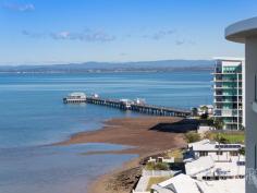  39 / 36 WOODCLIFFE CRESCENT, Woody Point -  Waterfront Properties Redcliffe Luxurious Sub Penthouse, Absolute Waterfront! Privacy and serenity surround this outstanding apartment. Idyllic Waterfront living with uninterrupted views stretching across the Bay to the Islands, Port of Brisbane and the City from two generous Level 9 balconies. The aptly named Waters Edge Complex is only 3 years old and is renown for quality, style and position. Internally you are greeted with space and luxury. Open plan living with a modern kitchen which features a huge walk in pantry. The dining and lounge flow onto the large main balcony with stunning views, ideal for entertaining or just relaxing with the gentle sound of the waves rolling onto the shoreline. The large Master bedroom also opens onto the main balcony and offers the same breath-taking views. Walk in robe and large ensuite with free standing bath, generous shower and wall hung vanity. Separate study and laundry are valued additions. Two good sized bedrooms and a second bathroom complete this impressive 159sqm internal design. Enjoy the outdoor lifestyle with beautiful walking and cycling paths that follow the Bay for kilometres. Great cafes, restaurants and village shopping which includes doctor, pharmacy and post office, all just a short stroll away. Features Include: - 3 generous sized bedrooms, one WIR and two BIR - 2 beautifully appointed bathrooms - Well equipped kitchen with huge walk in pantry Smeg appliances - induction cooktop, oven, rangehood, dishwasher and microwave - Ducted and zoned air conditioning throughout - Secure building with basement parking for 2 cars side by side and lock up storage - Swimming pool in the complex - Beautifully maintained building and gardens - Reasonable Body Corporate fees Your waterfront lifestyle awaits at Waters Edge! Phone Mark 0413 447 576 for an inspection that will impress. 