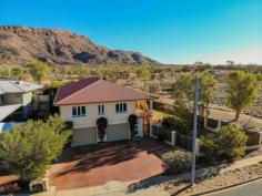   21 Mparntwe Drive Larapinta NT 875 $850,000 Located at the end of a quiet Cul-de-sac, close to the McDonnell ranges with the large Crown Reserve as part of your back yard this magnificent two storey home offers every possible luxury as well as magnificent, totally unimpeded view into the depths of the Milky Way. Intelligently laid-out over two levels and with impressive attention to detail, this stunning four-bedroom, two bathroom home is designed for the modern family, with the addition of a fully self-contained apartment style Granny Flat, ideal for mum and dad when they come to visit or somewhere to run your home business. The well-designed kitchen is sleek and stylish offering a functional layout with gas cooktop, wall oven, modern canopy range-hood, ample storage and preparation space. The expansive open plan dining and family area sits adjacent to the kitchen and is complimented by extensive use of double-glazed windows, framing the amazing views. Centrally located with outstanding acoustics, this wonderful space is perfect for bringing the family together! Step out through the French doors to the amazing outdoor living area, ideal for large family gatherings, this tiled undercover verandah gives you the ultimate resort feel. The master bedroom has large built in robes and a gorgeous ensuite. It also has window shutters turning the daylight into night-time, making it an ideal room for shiftworkers to get much needed sleep during the day. The additional 3 bedrooms offer complete flexibility for you and your family's needs, whether it's for the kids, a study or a gym, these very generous rooms will not leave you wanting for space in any way. The main bathroom offers an open shower, separate bath and a separate toilet with a double basin vanity for those busy mornings. Downstairs the secure garage is an absolute treasure trove of opportunity! There's room for at least 4 vehicles whilst still leaving loads of space for the working machinations of the "Cave" as well as a walk through into the main storage area of the home which is ideal for storing all the tools as well as perfect for the cellaring of a few special bottles of the grapes finest products due to the cool climactic nature of this room. It is very rare in searching for your new home that you will come across a property that has literally nothing for you to do except bringing your family and furniture to be able to start living the lifestyle in the comfort of an exceptional property such as the stunning home at 21 Mparntwe, we invite you to join us at the first Inspections this weekend of a property that is not only brand new to the Alice Springs Marketplace but is also sure to be 1 of the most sought after addresses this Spring! • Multi-zoned ducted reverse cycle air-conditioning • Intercom at entrance • Insulation throughout • Solar hot water system with board in place for solar panels • 27,000 Litre underground rain water tank • Fully reticulated low maintenance gardens • Privately built with exceptional eye for detail.. 