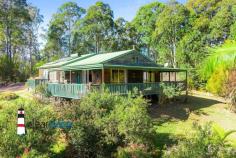  148 Ridge Rd Central Tilba NSW 2546 $690,000 "Kennocha" - Not far from Central Tilba and a short drive to Mystery Bay with its many pristine beaches, is this lovely home set on approximately 7 acres. Relax, sit on the covered veranda and enjoy the surrounding bushland with an amazing amount of birdlife and animals.  The Home: High ceilings with hardwood beams, timber floors, open plan living, dining and kitchen. Lots of large windows and doors leading onto the wrap around veranda. Three good sized bedrooms, central bathroom, separate toilet and spacious laundry are located at the rear of the home. Access is via steps at the front, near level entry at the rear or a ramp leading onto the side veranda for those who cant handle stairs. Power is connected to the home plus there is solar hot water and eight panels to lessen your electricity account. Water storage, approximately 90,000 litres. Acreage: 2.67 hectares approximately with some fencing. There is an established orchard, macadamia, olive, and many other fruit trees. From Ridge Road, there is a gently sloping driveway leading up to the home, shed, caravan and the carport. Caravan: Ideal for extra visitor accommodation when those unexpected guests turn up to enjoy your rural piece of paradise. A carport has been built over the caravan for protection and comfort in the warmer summer months. Rustic Workshop: Art Space, Man/Woman Cave, Games Room, Workshop, Craft Room etc. Make this space what you want it to be. Location: Located close to Corunna Lake, not far from Central Tilba and a short drive to Mystery Bay, Narooma or Bermagui. 