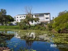  10 / 11 Creek Street, Redcliffe |  Waterfront Properties Redcliffe Private unit overlooking gorgeous parks and creek in the heart of Redcliffe CBD – East of Oxley! With easy lift access to the 2nd floor, this tranquil unit will delight those looking for privacy and the advantage of being less than a 5-minute stroll to Redcliffe’s stunning beaches, the popular coffee shops, cafés, restaurants, art galleries and more! It’s an enviable lifestyle right in the heart of the action. Straight across the road is the lovely Humpybong Creek, where you can enjoy walking your small dog along the flat walking paths. This complex of 10 units is only 8 years old and includes a generous rooftop deck complete with a kitchen, perfect for entertaining friends and family. Other features of unit 10 at Bella Creek include: • 2 spacious bedrooms, both complete with built-ins and fans • Master bedroom features ensuite walk-in robe with views overlooking Humpybong Creek • Modern kitchen with quality stainless steel appliances and Caesarstone benchtops • Air-conditioned living area, also with views out to the creek and parkland • Secure lock-up car parking with 2 spaces close to the lift • Low body corporate fees, pet friendly (subject to body corporate approval) Well and truly “East of Oxley” the proximity of this unit to Redcliffe’s foreshore, including the RSL, jetty, walking and bike paths are just some of the few reasons you will love living here! Call today to arrange your private viewing as units in such a perfect location, fantastic complex with lovely neighbours AND nearly all unit’s owner occupied – are a big rarity! 