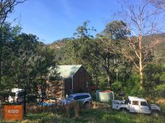  931 Oyster Shell Road Mangrove Creek NSW 2250 $650,000 Primrose Hill Cottage is on 18.86-hectare (46+ acres) mostly bush with around 2 acres of cleared land. The cottage 'a diamond in the rough' is of steel and timber construction with cedar cladding and has one bedroom and loft sleeper. The open plan kitchen/living area features a cathedral timber panel ceiling and flows out through glass panel doors on to the wrap around verandah with stunning views to the East and North. The sandstone escarpment of Mangrove Mountain plateau offers a stunning vista especially at sunsets. This beautifully picturesque setting will suit those with a love of nature, peace and serenity. The property is well protected sitting just above the creek flats of Mangrove Creek, with access to Mangrove Creek via Right of Way, there is an opportunity for some casual fishing or water sports or head up Oyster Shell road for push bike riding or bush walks in Dharug National Park. Whilst grid power is available the cottage is off grid with solar power, gas cooking, rain dam and bore water, composting toilet and slow combustion heating. NBN satellite internet is available which will provide WIFI mobile coverage. The property is zoned E2 and permitted with council consent are Bed and Breakfast accommodation and Home Occupations. The property is around 25 mins to Central Mangrove, with Spencer General store, medical centres, pharmacy, dentist, rural produce and hardware supplies, local golf clubs (with restaurants) all within around 15-25 minutes' drive, around 50 mins to Gosford City or Westfield Tuggerah, 40 mins to M1 on ramp at Calga (Northconnex motorway tunnel to M2 due for completion in 2020). Times are estimates and may vary due to weather and road conditions. For further information or appointment to inspect, please contact Michael Kidd on 0439 761 440. TO SEE ALL OUR LISTINGS, GO TO www.michaelkidd.com.au. To stay up to date with local real estate news and community events LIKE our face book page @michaelkiddpropertysales. Information has been provided by the sellers with other information being obtained from various sources and cannot be guaranteed. You must make your own enquiries as to its accuracy. Copyright Michael Kidd Property Sales P/L. 