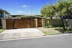  7 Margaroola Ave BIGGERA WATERS QLD 4216 $669,000 This home is a solid brick & tile structure with 3 Bedrooms, 2 Bathrooms, & a Single Lockup Garage + Swimming Pool. If you are looking for a project & renovating is "Your Thing" then this could be the property for you? The land size is 506m2 with a zoning presently permitting duplex redevelopment. The dwelling has so much potential. It sits amongst upmarket waterfront homes. The location is highly desirable. There is widespread gentrification occuring within this "Pocket Of Paradise." The home has a magical swimming pool, an outdoor entertaining area at the front of the house plus an enclosed undercover entertaining area at the rear of the property. All three bedrooms have robes, Internally, the flooring is tiled throughout, there is a dishwasher & split system air conditioner included. The beauty of this property is one can live in the home or rent the property- with a view to redeveoping in the future. Presently there are tenants in place, paying $600 p/w but vacant possession is definitely an option... 