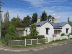  6 Railway St, Deloraine TAS 7304 $340,000 & $360,000 Beautiful character home with original mantles and 10.5ft ceilings, two separate living rooms, wool carpets, substantial kitchen with stainless steel appliances. Australian red cedar french doors and Tas oak polished floor boards, the main bathroom has an antique claw foot bath, basin and toilet. Tassie's winters are kept at bay via insulated ceilings and two wood heaters. The unique floor plan provides several options regarding bedrooms and living rooms, three bedrooms and three rooms that can be utalised at sitting room, lounge room or formal dining. Second bathroom had a shower and vanity. Fantastic flat 936sqm (approx.) fully fenced corner block, which enjoys all day sun in winter, with two street entrances for secure parking for boats, caravans etc. This c.1910 home has far too many Federation fixtures and fittings to list, not the least being the gorgeous archway to one of the three entrances. A fantastic blend of federation character and contemporary comfort has been achieved. Well positioned with quick access to schools, hospital, cafes, shops and the beautiful Meander river and its fantastic river side walks, the property is located in a quite part of Deloraine. A paved undercover alfresco area, workshed with power, laundry and second toilet,, established gardens and trees complete this lovely home. Call today for an inspection. 