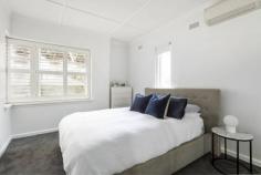  Unit 1/36 Robe St Kilda VIC 3182 $800,000 - $850,000 Due to Covid-19 restrictions, inspections of this property are currently not allowed. We may have a walk-through room by room video available. Please contact the agent to receive this video and discuss the property and the process of offers during this time. Located in an exclusive art deco block of two residences, this two bedroom apartment is located on the ground floor with its own private courtyard for utmost convenience and lifestyle. Impeccably designed, this bright and airy apartment opens into a neat hallway before opening into an open plan living with period features such as original mantle, ornate ceiling details and cornices. Decked in on trend black lacquered flooring, the modern spacious kitchen and meals area is a sight to behold. The modern gourmet kitchen featuring plenty of storage, benchtop working spaces and sleek stainless steel appliances is a delight to any epicurean. This beautiful dining and kitchen zone also contains a neatly tucked away laundry space and flows seamlessly onto a lush partially covered courtyard - perfect for kicking back with a glass of wine after a long day. In the generously proportioned master bedroom, you can find a built in robe and plenty of natural light. The second bedroom is also equipped with a built in robe, is equally well proportioned and naturally lit. A modern central bathroom services the apartment, complete with a bathtub. Conveniently located minutes from the refreshing St Kilda beach and the ever bustling dining and entertaining precinct around The Esplanade in addition all the delights St Kilda has to offer - an elegant lifestyle of convenience and recreation awaits! 