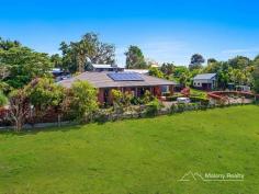  15A Tamarind Street Maleny QLD 4552 $735,000 Private 1114m2 block neighbouring farmland with North East aspect Covered outdoor entertaining area which opens to the level, landscaped garden Spacious modern home featuring large family dining area and media room Galley kitchen with quality appliances and walk in pantry Four bedrooms plus large study, main with ensuite, large WIR and delightful private courtyard with outdoor shower Reverse cycle air con and a great north east aspect make this a very comfortable home 3kw battery solar system, 10,000L water tank plus town services Double lock up garage plus a separate workshop/studio with huge potential and a garden shed The landscaping has all been designed for ease of care while still providing a fantastic display of colour and texture all year round. On a private, near level block just 10 mins walk to Maleny this stylish home is perfectly presented with nothing to do but move in and relax. Don't miss out, properties of this calibre seldom come on the market in town. All information contained herein is gathered from sources we believe to be reliable. However, we cannot guarantee its accuracy and interested persons should rely on their own enquiries.  