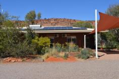  3485 Greatorex Road Ilparpa NT 0873 $959,000 'Forget the Desert Park'. This impressive property will be your very own desert oasis. Nestled within the privacy of established manicured gardens this magnificent four bedroom, two bathroom home is enveloped in light and comfort with amazing views from every angle. Surrounding this home is a scene that must be seen to be believed with an award winning garden designed for low maintenance whilst providing absolute beauty. Inside, the crisp white walls, polished slate flooring and high ceilings throughout create a style many will envy. The contemporary Kitchen provides ample storage with gloss cabinetry, complete with the most up to date quality appliances to cater for the seasoned entertainer and the large family gatherings. The calming Ilparpa Range view captured through the extensive use of glass is just magical. Inside offers -4 Bedrooms plus Study -2 living areas -Combustion fireplace -Evaporative cooling throughout -Split system air-conditioning to Living room, Kitchen and 3 Bedrooms -Quality wool carpets to living room and all bedrooms Outside offers -1 hectare of land -Brick veneer home with steel frame -Wifi datalogger and smart meter -PV Solar System 6.615 kw (Fronius Primo 5.0 INT Inverter) -Solar hot water -Large verandah for outdoor entertaining -2 bay shed + 3 bay shed with remote control doors -Reticulation system for low maintenance garden care -Septic System -Chicken coop and large veggie garden -Easy access to the claypans from the back of the property This property screams serenity' and will reflect the personality and taste of those accustomed to the best in quality design, finishes and lifestyle.. 