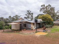  75 Bilgoman Road Glen Forrest WA 6071 $375,000 Creative inspiration, a sense of adventure and some hard work will transform this partially renovated 3 bedroom, 1 bathroom home into a ‘Gem in the Hills’. The 1935-built home boasts wide jarrah floorboards, a high ceiling lounge, and good-sized bedrooms. The gently sloping ½-acre block and sought-after location mean this renovators’ delight is bursting with potential. • 	 3 bedrooms 1 bathroom • 	 1935-built timber & iron • 	 Partially renovated home • 	 Wide jarrah floorboards • 	 OP family/kitchen/meals • 	 High ceiling living room • 	 Orig renovators’ delight • 	 Gently sloping grounds • 	 Elevated 2023 sqm block • 	 Superb Glen Forrest locn The charm and sense of history surrounding this property are inescapable as blossom trees, and a tall perfumed magnolia draw you to the welcome of an elevated front porch. Step inside and discover wide jarrah floorboards and open plan lounge/kitchen/meals area. The lounge boasts a high ceiling and wall of built-in shelving. A slow combustion fireplace hints at quiet, cosy days while reverse cycle air conditioning ensures year-round comfort. A country-style kitchen with timber benchtops, an electric hob, dishwasher and oven is arranged at one end of the lounge room along with a meals area that opens on to a balcony overlooking the front lawn and gardens.  Steps from the balcony lead to a paved terrace – an ideal spot for summer entertaining – and on to a large fire pit – ready and waiting for winter bonfires and toasting marshmallows. Two of the spacious bedrooms have been renovated and boast carpet and built-in robes. The third bedroom is unfinished, but, with some work, this large room would transform into a delightful space. Most of the work has been completed in the family bathroom with a modern soaking tub, shower, vanity, and W.C. in place. At the rear of the home, a brick-paved verandah and a lawn terrace offer additional outdoor living space and a great place for kids to play or pets to run around. With ½ an acre, there is plenty of room for veggies, chicken and fruit trees. Quiet, private and well-connected, this property nestles between Glen Forrest and Darlington, with the Heritage Trail offering a delightful path to both towns. You can walk everywhere from this superb location; Glen Forrest Primary School, Helena College Senior School and Glen Forrest village are all on the doorstep. For those who see, and feel the potential, the impulse to transform this unpolished gem into an idyllic home will be irresistible. To arrange an inspection of this property or for friendly real estate advice from proven performers call Bob Johnston on 0429 956 378 or Jan Johnston on 0427 956 378. 