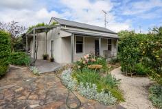  14 Victory Ave Foster VIC 3960 $610,000 Situated just a short stroll to the centre of town on a corner block of approx. 780m2 this delightful home has been cleverly designed to maximise natural light and views of the stunning gardens. The original period cottage has been reborn with a superbly constructed modern extension, seamlessly blending open plan living with alfresco entertaining and every luxury for a comfortable lifestyle. Three bedrooms – master with built in window seat and walk in robe. Magnificent main bathroom with large shower recess, and second bathroom area adjoining the fitted laundry / utility room. The beautifully appointed kitchen is the heart of the home with a stunning ‘Falcon’ dual fuel freestanding cooking range, exceptional storage and preparation space plus a servery bench to the adjoining dining area. Spectacular living room centered around the ‘Jetmaster’ fireplace and built in bookshelves, flowing out to the sundrenched north facing decking and private flower filled gardens. So many extra features – double glazing, zoned RC/AC, screened BBQ pavilion, lock up garage, vegetable beds, water tank, built in storage and seating, premium quality soft furnishings, wallpapers and light fittings. If you are looking for a haven to escape the everyday, this is a must see. 