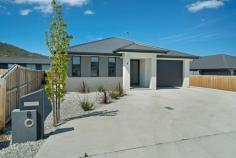  6 Banksfield Street Rokeby TAS 7019  $525,000 From the street, the lovely landscaped rock garden marries beautifully with a contemporary design residence that pleases the eye immediately of what seems a modest size home however when you step through the double glass front doors you are hit with grandeur, an expansive living area that features superb design and an impressive space for the heart of this home. The open living room upon entrance encompasses the lounge area, dining and centre piece quality kitchen that is a real attraction in this large room which even has space for a pool table, making this area perfect for entertaining. The sleeping quarters offers two rooms with built-in robes while the large master has a walk-in-robe and quality en-suite finished in light tones. The main bathroom replicates this design while featuring a nice deep bath. The lavatory is a separate room. The generous entertaining deck is internally accessed from the living area which leads to a level landscaped yard. The garage encompasses the laundry and offers good storage space while the additional external car space provides excellent OSP. This property is a pure delight, impressive in design and style throughout with expansive living spaces that would suit a variety of lifestyles. If you are looking for a quality stylish modern home this is the one. FEATURES: • 	 Air Conditioning • 	 Built-In Wardrobes • 	 Close To Schools • 	 Close To Shops • 	 Close To Transport • 	 Deck • 	 Garden.. 