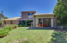  2 Huxham Place Fadden ACT 2904 Marvellous Tri-Level family room comprising 4 bedrooms, ensuite, separate lounge and dining room, kitchen with family room plus large rumpus room. Positioned in a quiet cul de sac with striking mountains views especially from bedroom one. Well designed floor plan featuring high raked ceilings and exposed beams which creates the spacious feel throughout. Polished timber floors in hallway and kitchen/family with quality carpets throughout the remainder of the home. The living room on the entry level of the home contains a full brick feature wall and a built in music cabinet. The family room opens out to the north facing rear entertaining paved area comprising bbq and timber decking. This is a very stylish family home with many additional features that your immediate inspection will reveal. Features: * Contemporary design * Tri-Level * North to the rear * High raked ceilings with exposed beams * Large living areas * Separate lounge rm * Separate dining rm * Kitchen with b/bar, d/washer and 5 burner gas hotplates * Family room with fireplace * 4 bedrooms main with walk in robe and ensuite * Rumpus or music room * Ducted heating and cooling (heat pump) * Slow combustion fire in family room * Polished timber floors in hallway and kit/fam * Quality carpets and curtains throughout * Very private and well established garden both front and back. * Colourbond fencing * Internal access to very large double garage (auto doors) and storage Home size 227sqm Garage size 44sqm EER 0.5 Block size 974sqm Please contact Philip Kouvelis 0412622420 for further details and inspection times outside of open homes. 