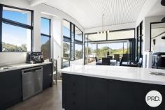  4 Coastwatch Close KORORA NSW 2450 $1,375,000 - $1,425,000 Located in one of Korora's most sought after enclaves, this 4 bedroom architecturally designed home delivers the best of coastal living and is only footsteps from the sands of Korora Bay Beach. The grandeur of this home with its size and architecturally curved roof line, you will appreciate that this home is in a class of its own. Designed over 3 levels, the floor plan provides private spaces for all members of the family, capturing the ocean views and northerly aspect. Level 1 offers large living and dining spaces for relaxed family living and the natural warmth of the polished timber floors adds ambiance to the home. The high-end entertainers kitchen with stone benchtops and sleek cabinetry is well appointed and fuses the outside entertaining area with indoor living, taking advantage of the sea breezes. There are 2 queen size bedrooms and the media/cinema room on this floor. On the upper floor there is a master suite with its own balcony including a huge luxury en-suite and walk-in robe as well as a lounge area providing a private space and commanding views out over Korora Bay. On the lower level there is a 4th bedroom with ensuite that overlooks the pool and gardens. There are so many features in this home including the revolutionary Ritek triple insulated roofing system that has a high thermal rating reducing energy costs, auto oversized triple garage as well a huge storage area currently used as a home gym. There is even a spare room that could be used as a work from home office. The beautiful outdoor areas lovingly wrapped around tranquil gardens are the real standout with an amazing (10x5m) in ground swimming pool and deck complete with built-in entertaining gazebo designed to create a perfect beachside lifestyle. 