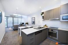  5/10 Burke Crescent Kingston ACT 2604 $450,000 ***Although restrictions have lifted please remember COVID-19 guideline rules. It is requested that attendees sign in using Check in CBR app with the displayed QR code at this property. Social distancing is to be respected.*** This fantastic loft style 1 bedroom apartment offers executive style living with a desirable design and in a location you won’t want to miss! The double height windows allow plenty of natural light throughout the apartment, giving a great sense of space. The well-equipped kitchen, which opens off the living area comes with ample bench space and a dishwasher. Ensuring your comfort with reverse cycle air conditioning, a washing machine, dryer and built-in robe to the loft style bedroom. To the front of the property, the private courtyard will help you relax, entertain or unwind with a leafy outlook. Perfect for first home buyers or an addition to your property portfolio. Home to excellent restaurants, popular bars and beautiful cafes, your neighbourhood hangouts would be some of Canberra’s finest. When you’re done eating, browse the chic boutiques in Kingston and Manuka, picnic or exercise at picturesque Lake Burley Griffin, shop at the Fyshwick Markets and enjoy Australia’s national treasures, all walking distance away. It only takes minutes to drive to the centre of the City and the Parliamentary triangle. Features of this apartment include: 1 bedroom apartment Loft design Open plan living Well equipped kitchen with fridge and dishwasher Reverse cycle air conditioning Built in robe to loft style bedroom Washing machine Dryer Courtyard Car space Fantastic investment opportunity! 