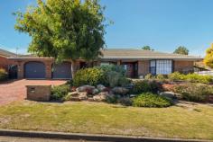  19 Vendale Dr Flagstaff Hill SA 5159 $655,000 to $685,000 Set on the high side of the road with sloping valley views your only opposite neighbours, this beautiful 1990-built home is certain to be an instant family favourite. Equipped for the whole family with four generous bedrooms, a master suite enjoys front position with a gorgeous bay window outlook, huge ensuite with shower plus spa bath and walk-in robe. A central family bathroom is equally furnished with its own large bath and a convenient separate w/c. Accessible from the entry hall, an enormous formal living and dining will take your breath away. Sky high raked timber ceilings and another bay window create a feeling of infinite space, while an exposed brick wall and new carpets add warmth. A spacious kitchen is the heart of the home in both a literal and emotive sense, with adjoining dual living and dining spaces on either side. Here, home cooks will flourish in a pale grey kitchen with alfresco views, dishwasher, wall oven and electric cooktop plus walk-in pantry and infinite bench space overlooking the skylit meals and family area. Entertainers and young ones will love a tiled rumpus with built-in bar, sink, bar fridge and sliding doors onto a tiered northerly backyard. A substantial paved area is half protected by a pitched roof pergola with feature fishpond and fountain, providing the perfect year-round tranquil alfresco surrounded by a sea of greenery. Steps lead up to a second tier where lawn awaits footsteps – or pawprints – of little legs, surrounded by established hedging and flora. So much to love: – Wide 24m frontage & large 743 sqm (approx.) block – Built-in robes to bedrooms 2, 3 & 4 – Extra roomy double garage with third w/c + second driveway for caravan or boat – Garden shed & automated irrigation system – Evaporative ducted cooling, gas ducted heating – New carpets throughout What can we say about the location? Restless legs will be well stretched here, with countless walking tracks, hiking trailheads, parks and the Sturt Gorge at your toetips. A five-minute drive or less will take care of any shopping needs either at Westfield Marion or Aberfoyle Hub, with various local schooling options and 100m sprint to the bus to the CBD and Flinders Medical Centre & University. 