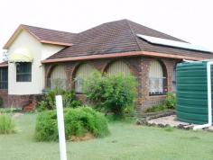  13151 Clarence Way Bottle Creek NSW 2469 $450,000 Set in a scenic location this spacious brick & tile residence is set on 2.4 hectares (5.8 acres) and features 3 bedrooms plus 2 sleep-outs, good sized rooms, air-conditioning, ceiling fans and a log burner for cosy winter nights. Water supplied by 25,000gal rainwater tanks plus a fully equipped bore for gardens and pets. There is a double carport and an entertainment area. A machinery shed with concrete floor and power. 2 horse boxes plus a home orchard, stockyards and good fencing. A top spot for the family with room for a house cow & calf or a couple of ponies. Don't miss this opportunity. 